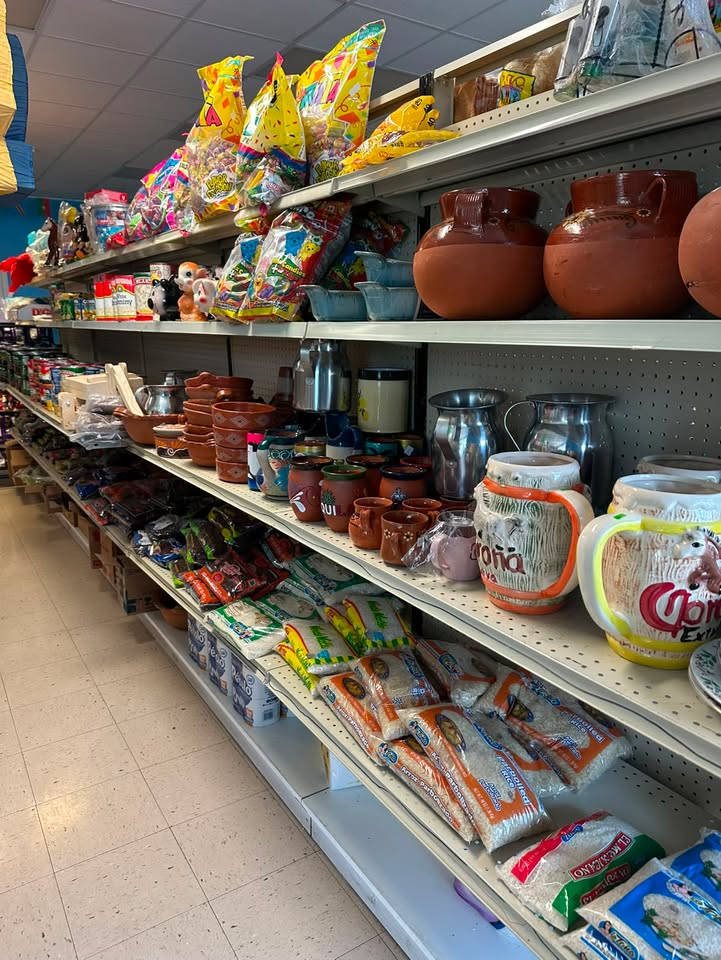 Store aisle with candy, clay pottery and rice